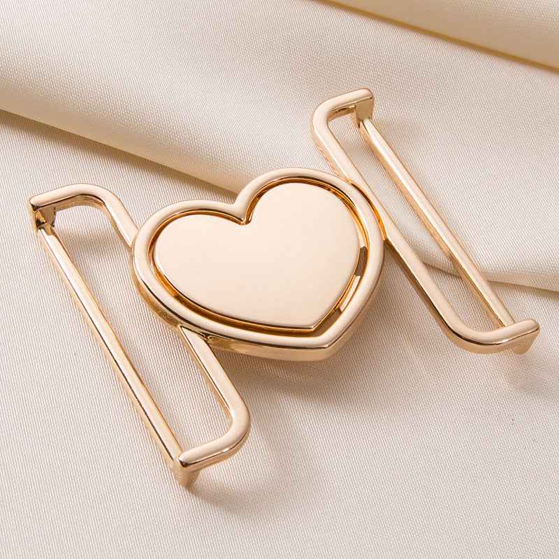 Gold-tone heart belt buckle clasp with curved frame and pin closure