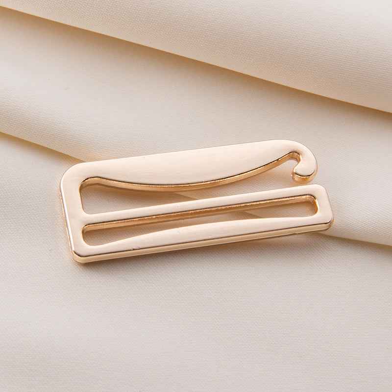 Bra strap adjuster with gold-tone metal frame and sliding bar for lingerie