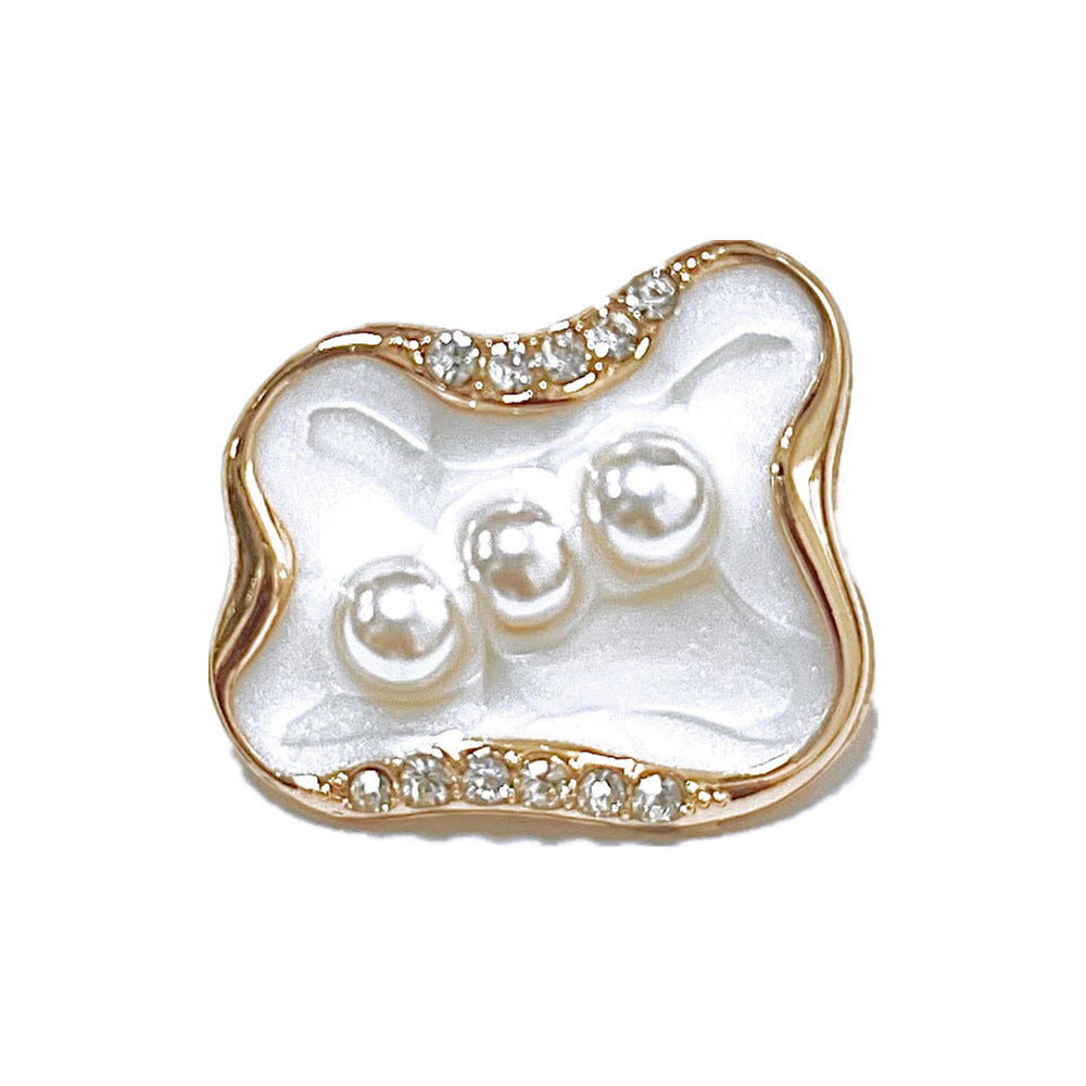 Style A 25MM button: white faux-pearl swirl with three pearls, gold rim, rhinestones
