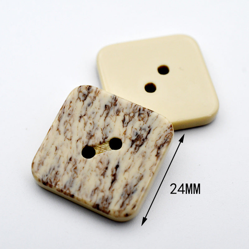 Square beige marble resin button with two holes; size 24mm