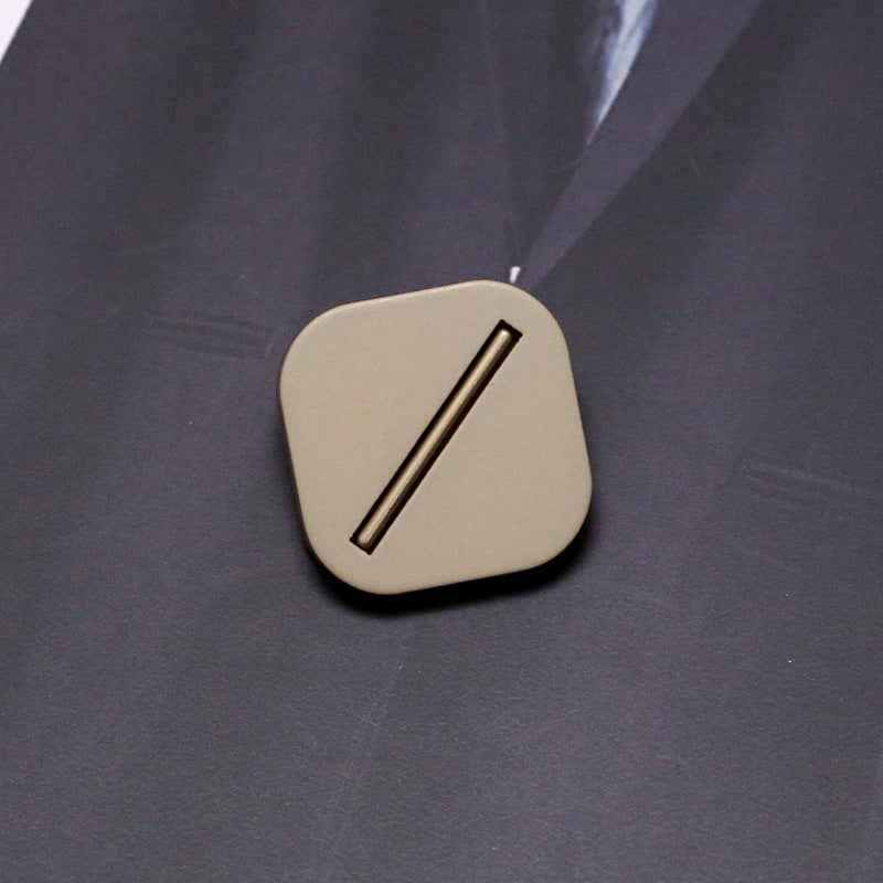 Beige square resin shank button with metal base and single bar slot
