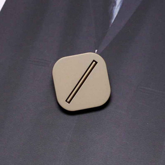 Beige square resin shank button with metal base and single bar slot