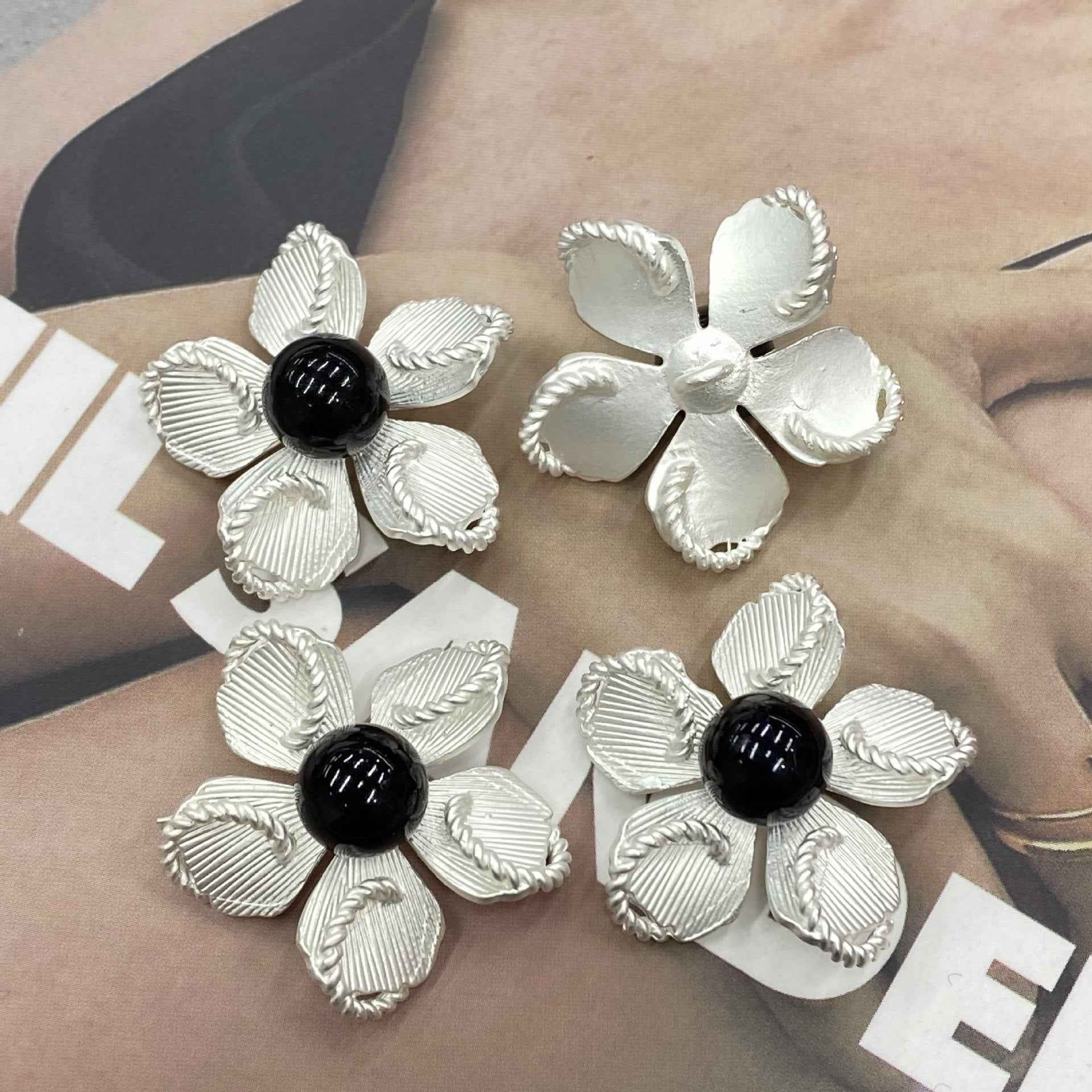 Set of silver shank flower buttons with black pearl centers, 30mm
