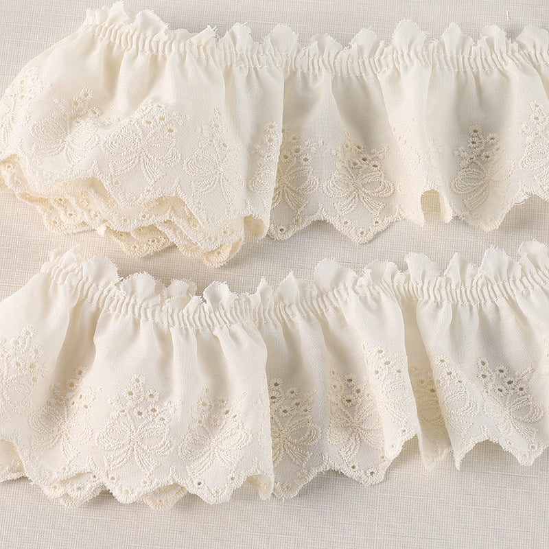 Off-white butterfly lace embroidery trim, pleated sections with scalloped bottom