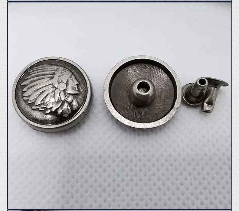 Round rivet cap with detailed bird-and-feather design; underside shows centered hole