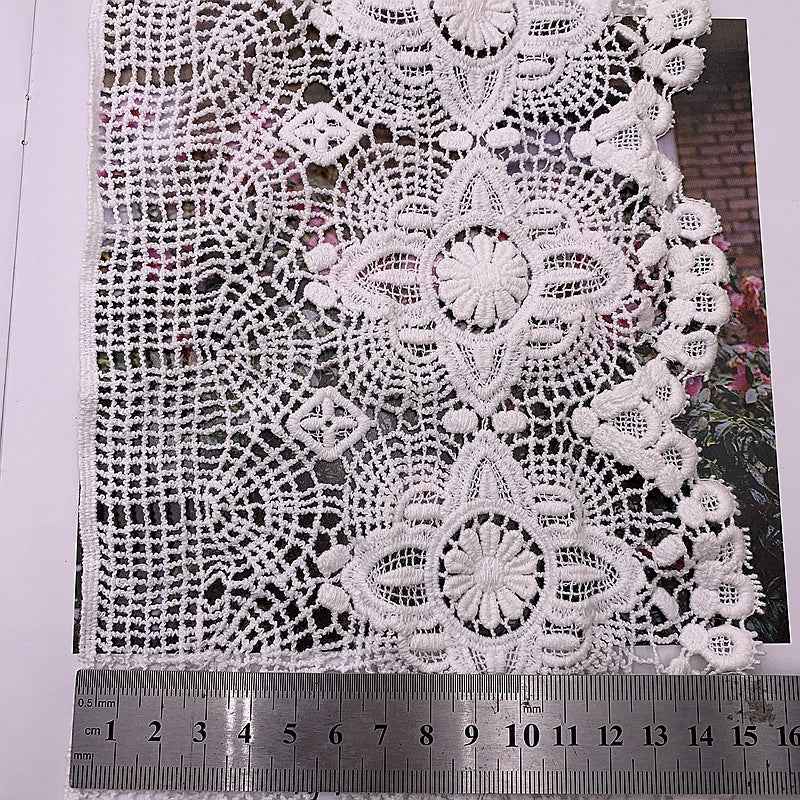 White wave lace trim with large central flower, small rosette details, and lace texture