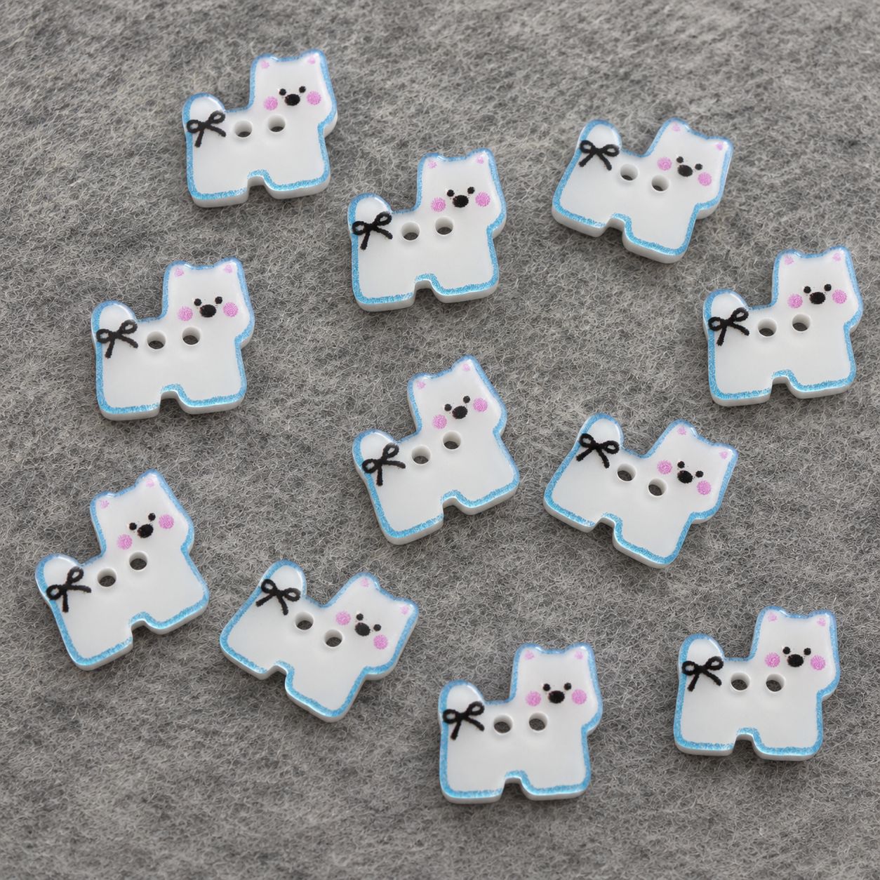 Set of puppy resin buttons with white centers, blue outline and bow, two holes each