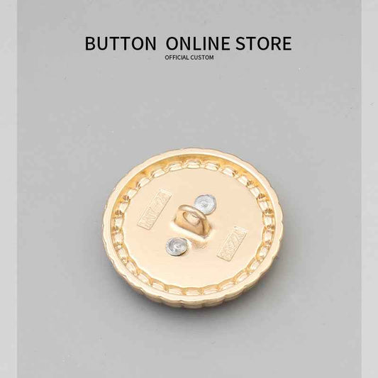 Round button back, gold rim, metal shank posts and loop for sewing.