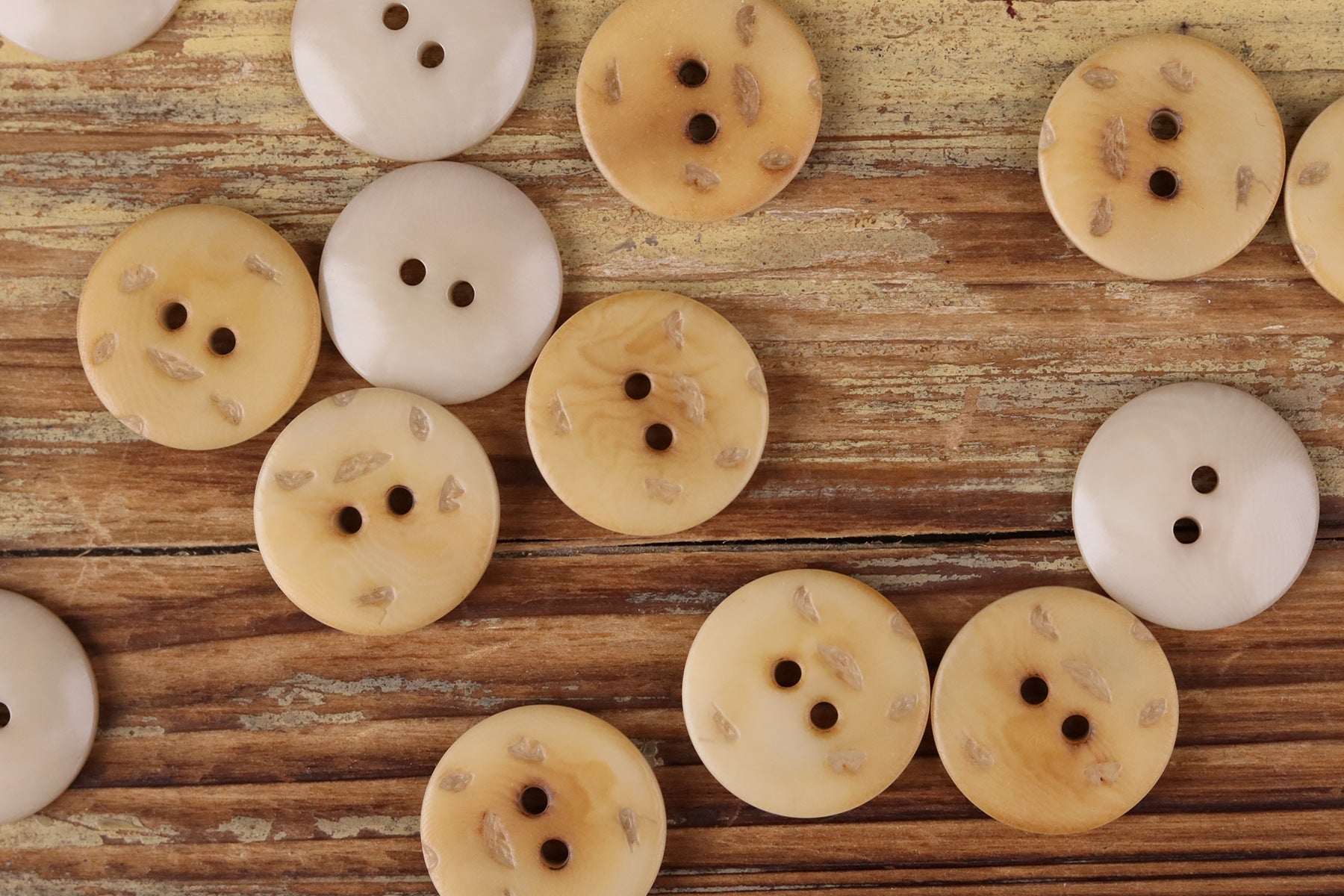 Round 2-hole buttons in white, cream, and tan shades, flat vintage style set