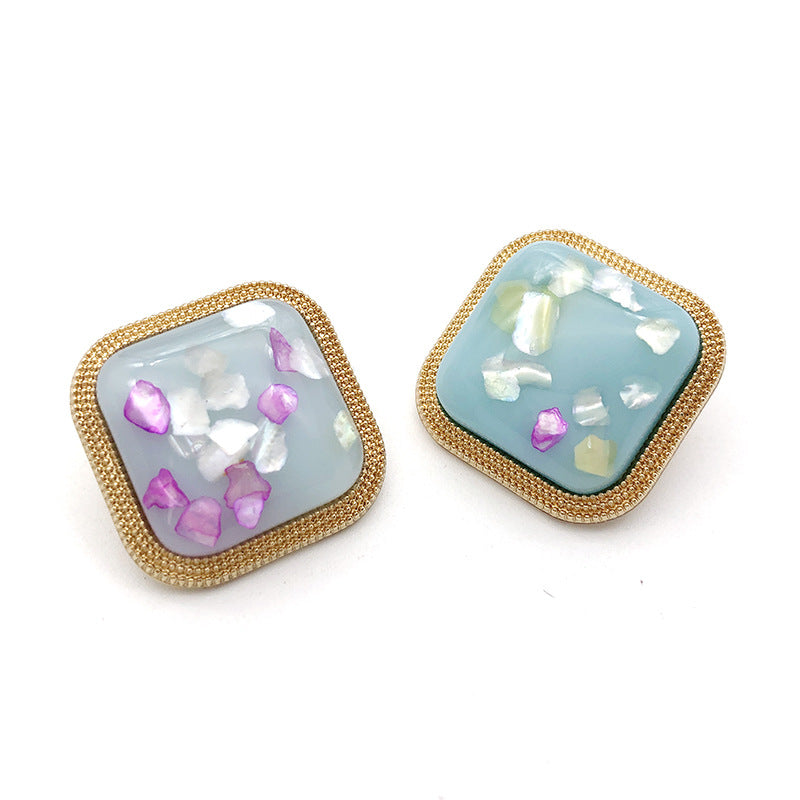Irregular gold metal shank button, Style 15, square frame, blue with purple accents