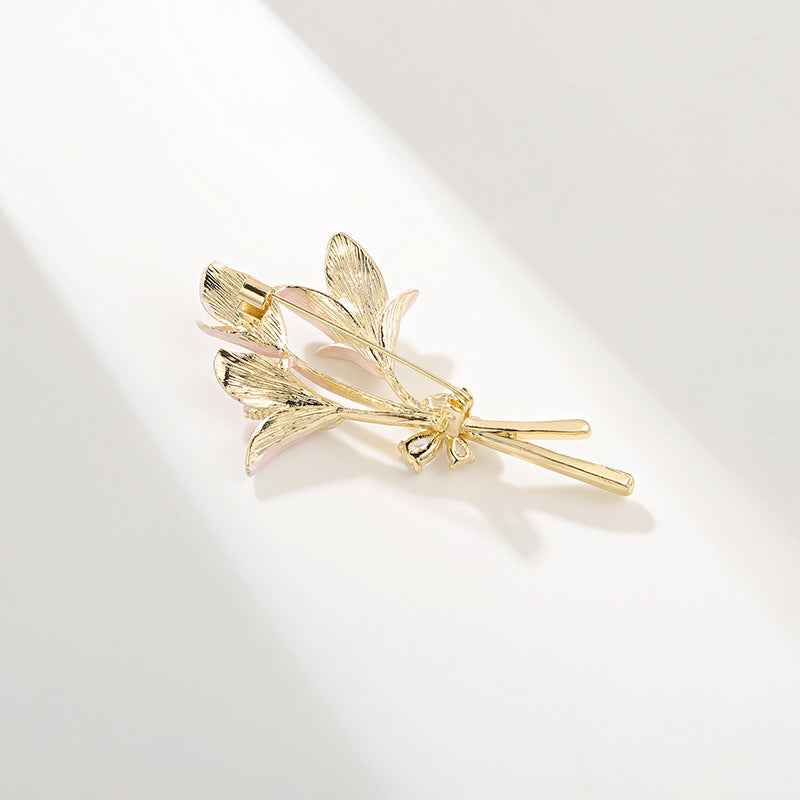 Rose gold lily enamel flower brooch back with gold locking pin and clasp