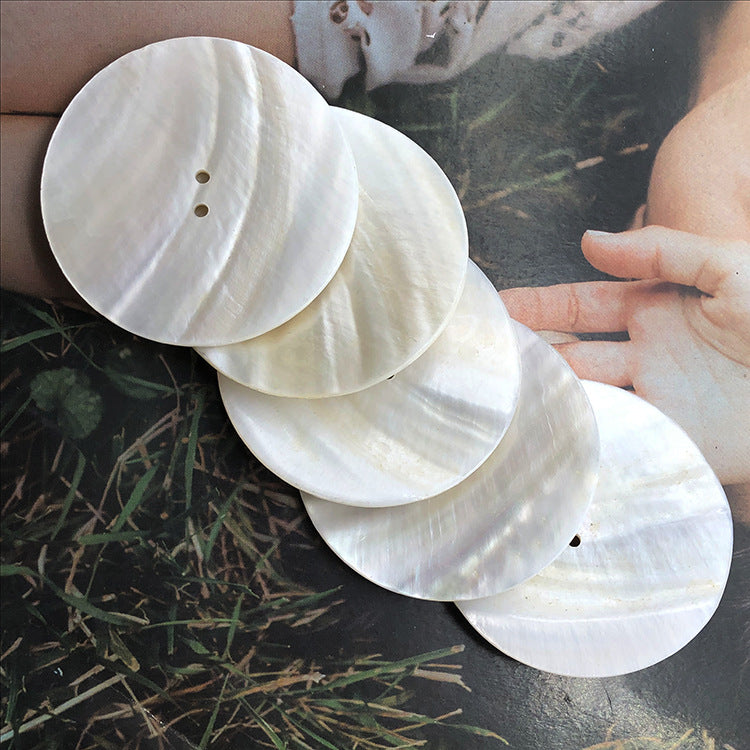 Set of white round shell buttons with two holes each, large 30–60mm
