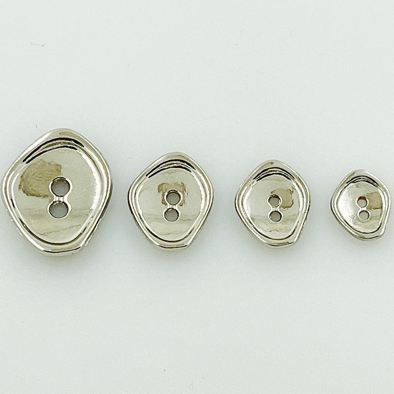 Small irregular 2-hole metal buttons in silver finish, with raised edge detailing