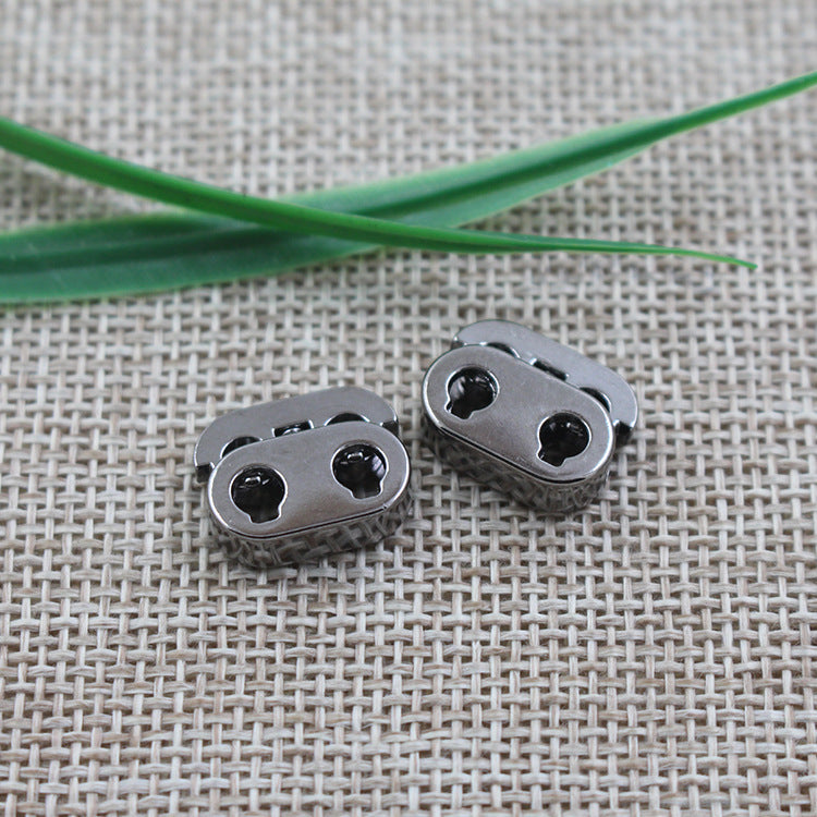 15mm silver double-hole adjustable cord lock, zinc alloy, angled close-up