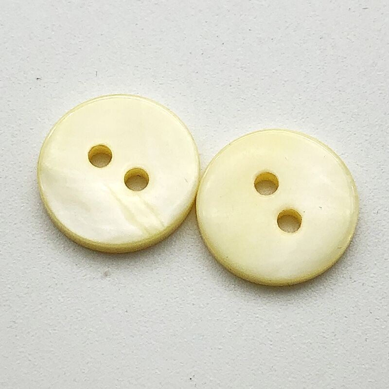 Yellow round two-hole flat shirt buttons, 12.5mm, close-up (20 pcs)