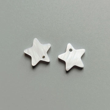 White star shell buttons, single-hole, two pieces shown