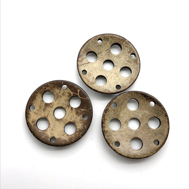 Round 9-hole coconut shell decorative buttons, 44mm; set of 3 shown, tan-gold.