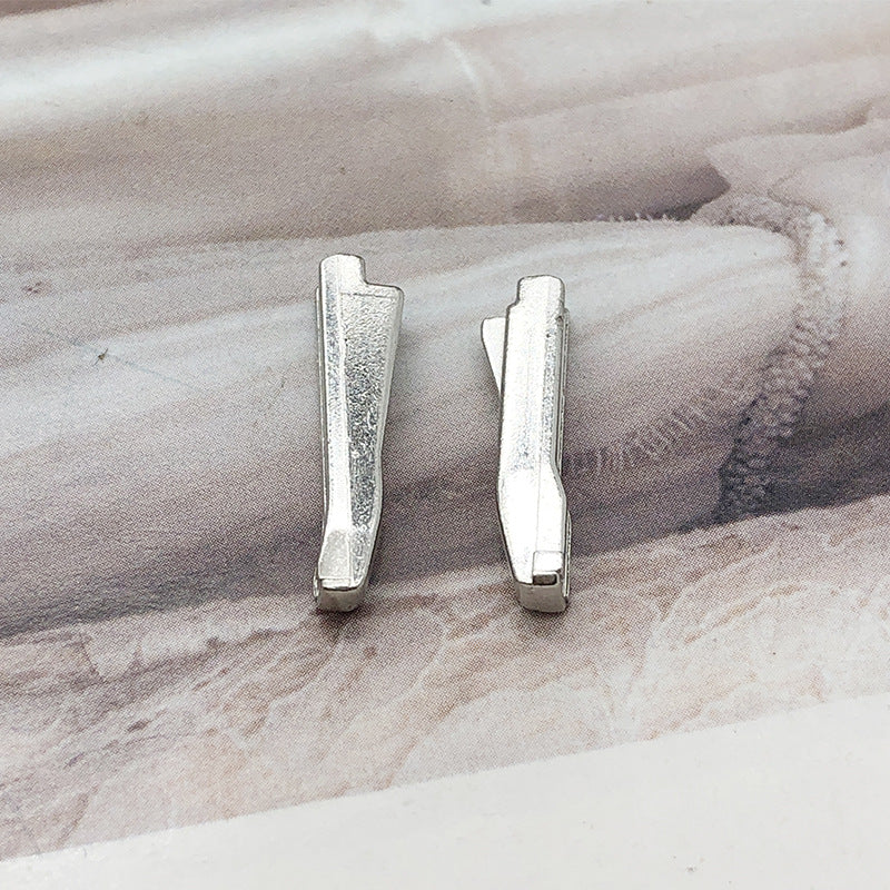 Pair of silver-tone #5 zipper slider retainers with metal insertion pin tabs