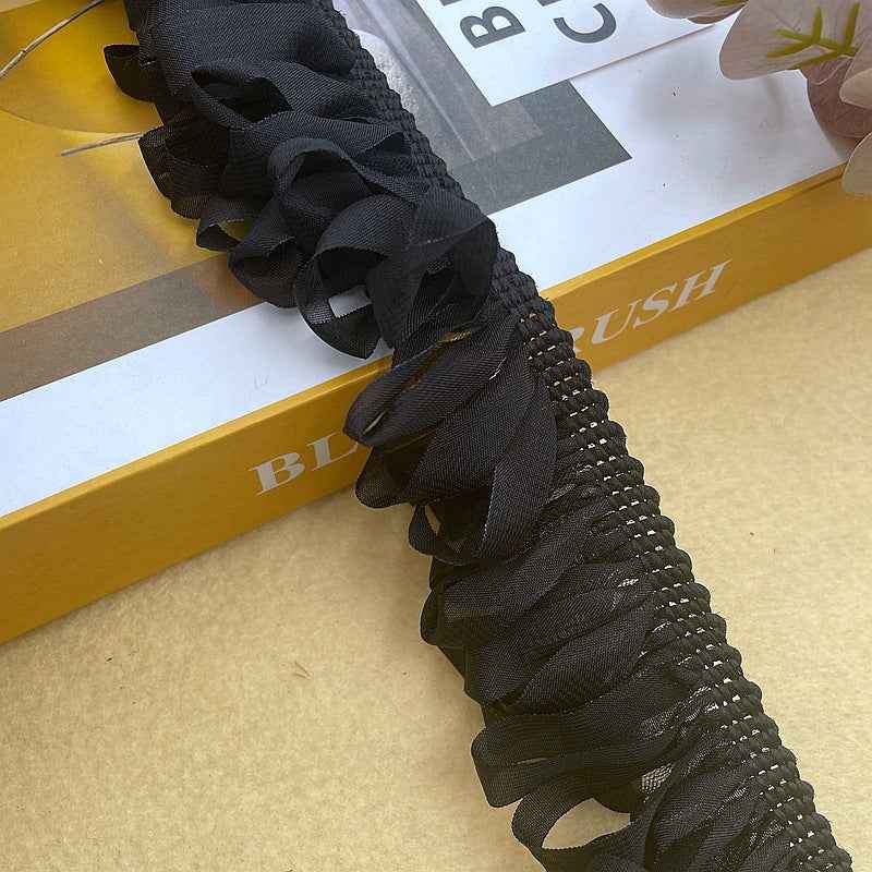 Close-up woven chiffon fringe trim with tassels, braided edge, black, 5 cm