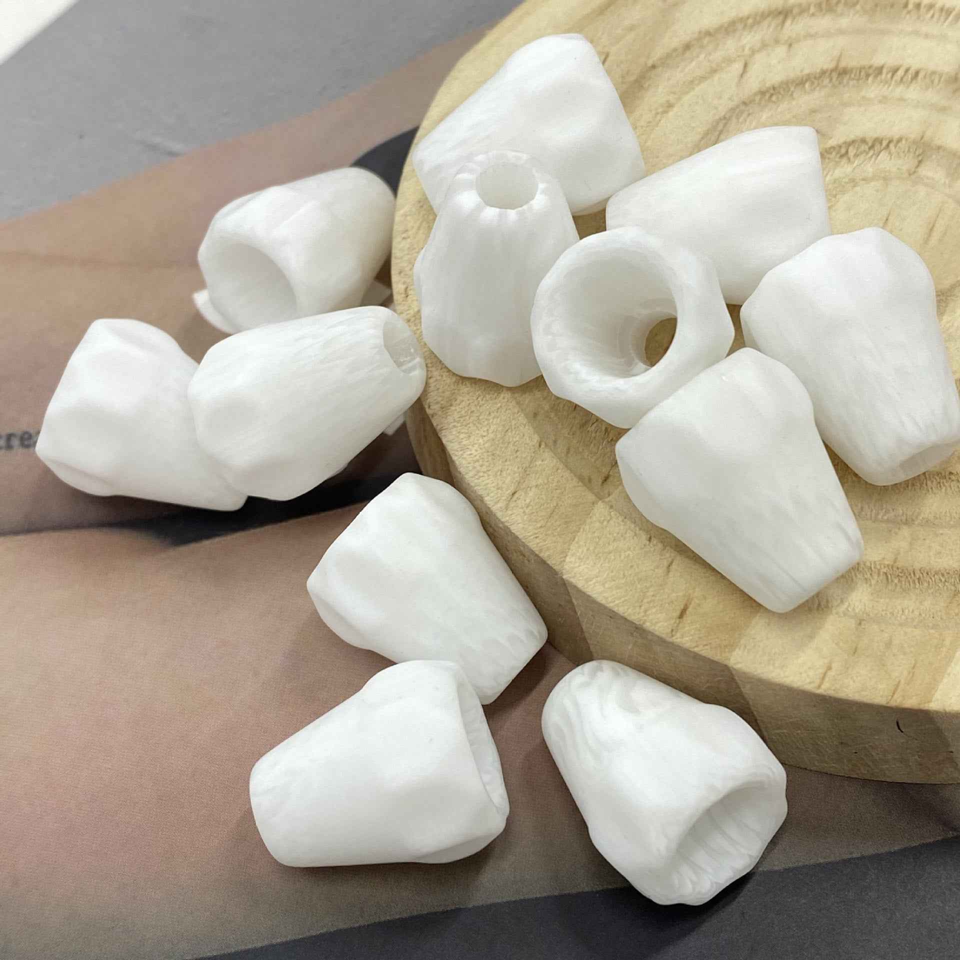 White resin single-hole cord end stopper, bell shape