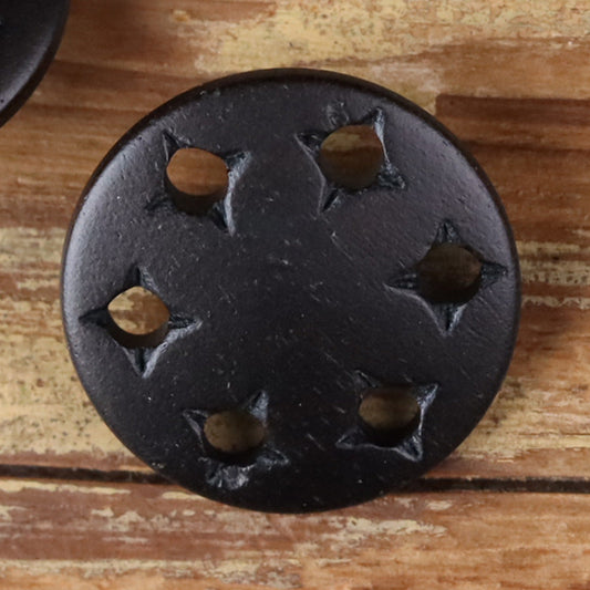 Black star-cutout horn shank button with metal shank and star-shaped cutouts