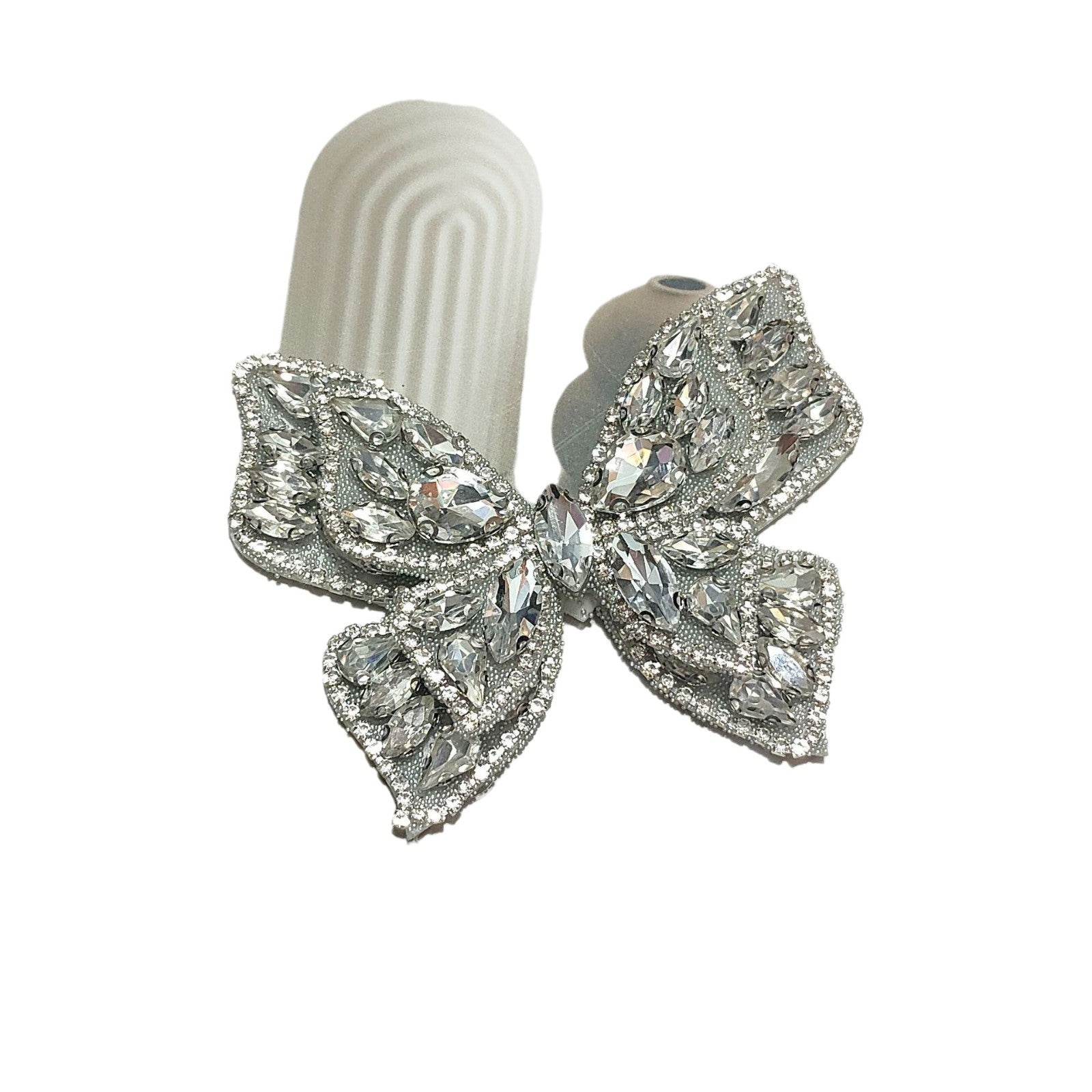 Silver rhinestone butterfly applique with layered stones and prong chain drops