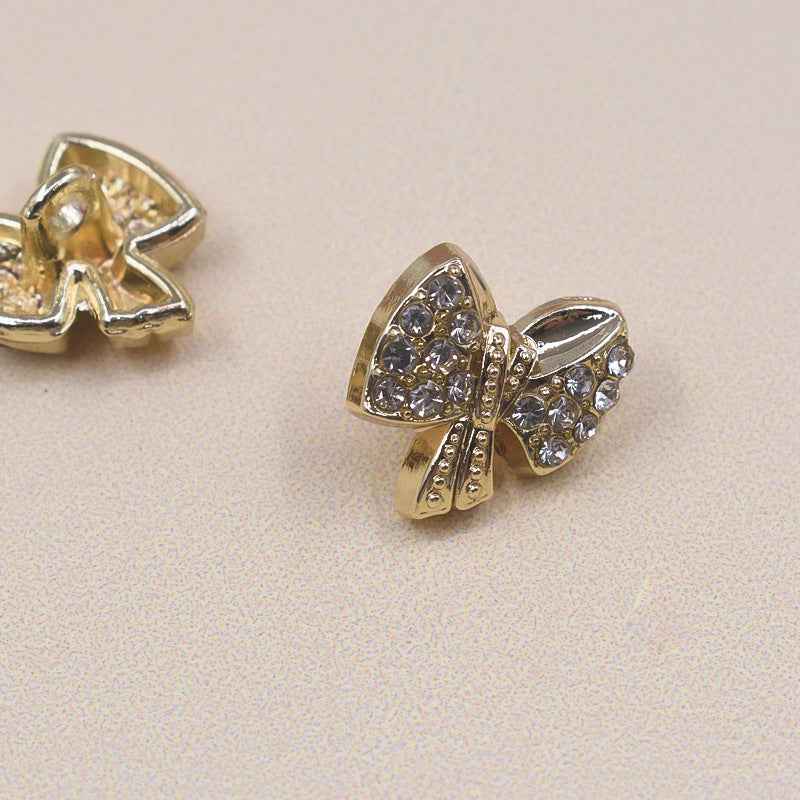 11.5mm Bow rhinestone shirt button, gold metal, faceted crystal center