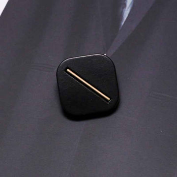 Black square resin shank button with metal base, single bar slot detail
