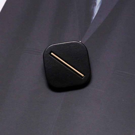 Black square resin shank button with metal base, single bar slot detail