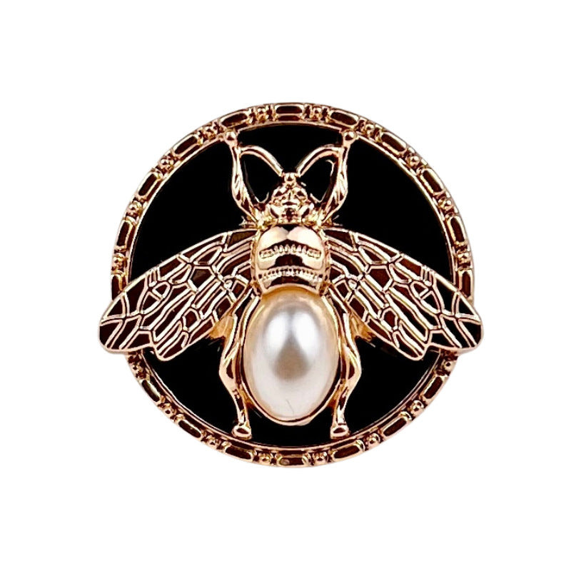 Gold round bee pearl metal shank button, wings pattern and pearl center on black