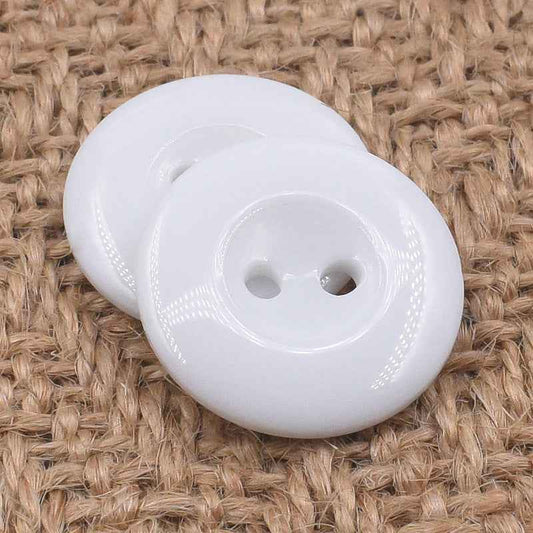 Round white 2-hole resin button, front view with two holes and glossy ring around