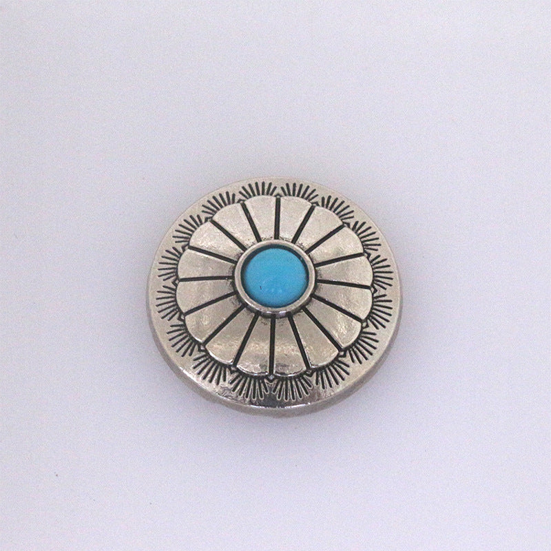 Turquoise metal stud button with radiating rays and bright blue center stone