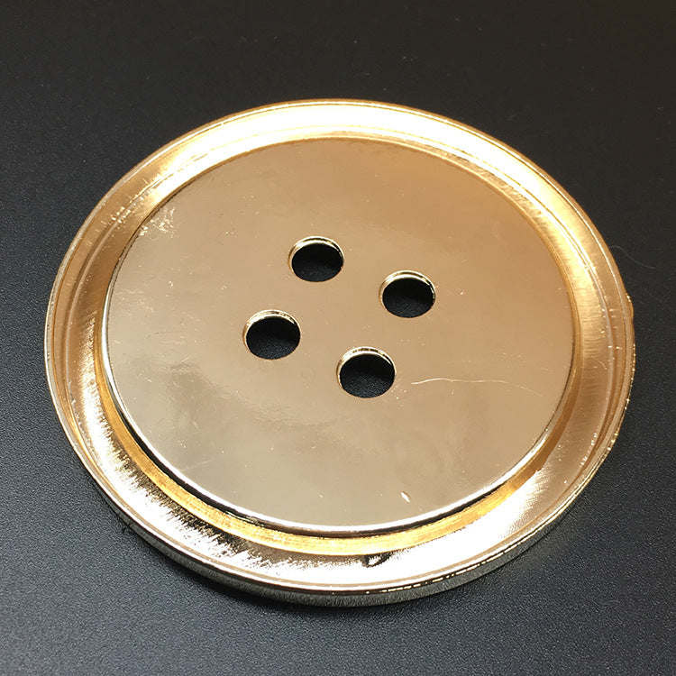 Rückseite goldfarbener 70-mm Rundknopf aus Metall mit vier Befestigungslöchern