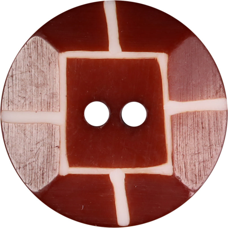 Round red buffalo horn 2-hole button close-up with white cross inlay