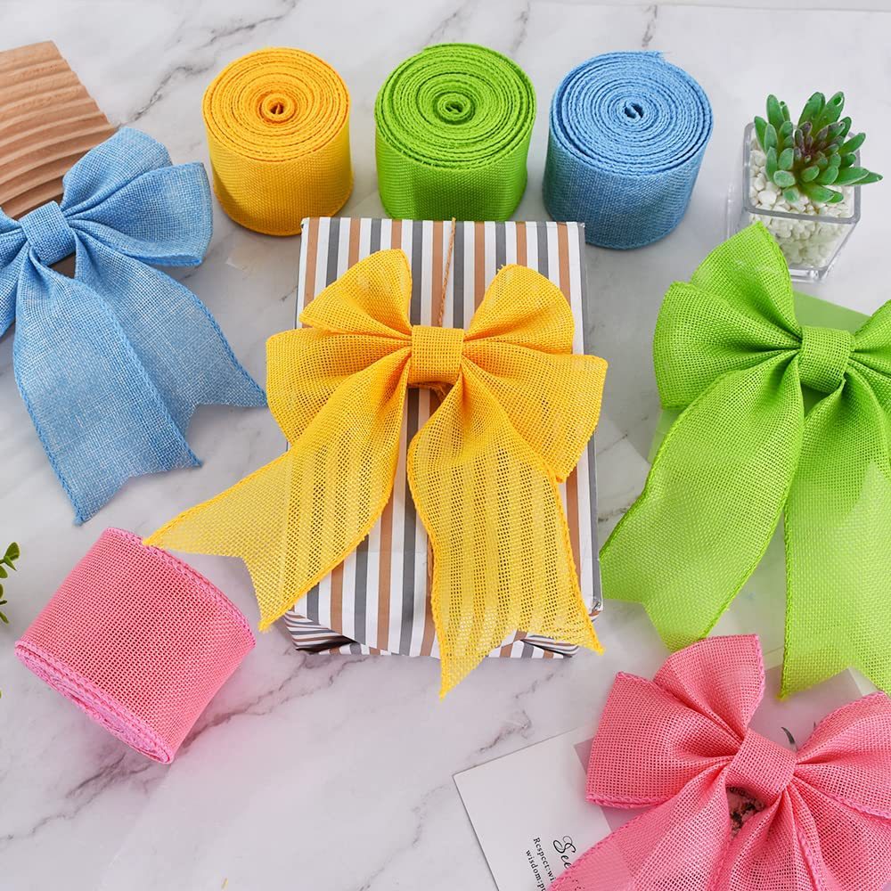 Mixed-color cotton ribbon spools and bows: yellow, green, blue, and pink