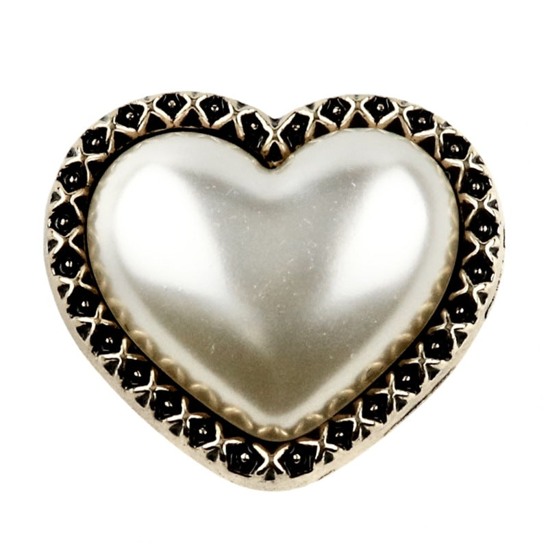 Heart shank button: white iridescent pearl center, bronze rim with black pattern