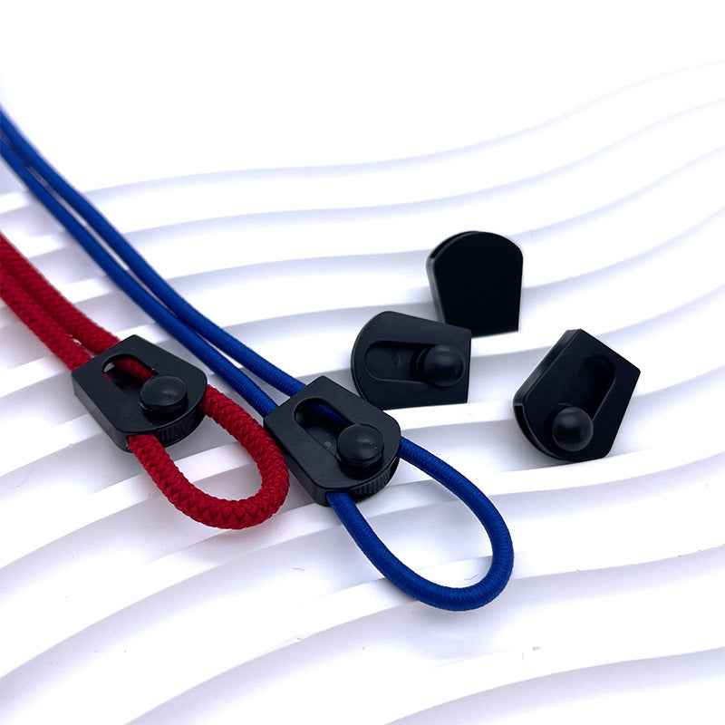 Black flat cord adjuster stoppers with blue and red drawstrings threaded through