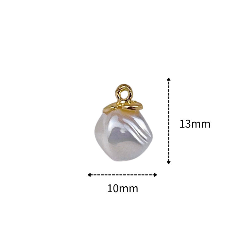 Pearl-shaped button, white ridged oval with gold ring shank; size 10mm x 13mm