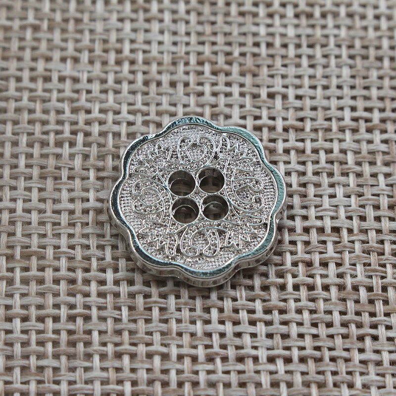 Silver-tone vintage floral 4-hole alloy button with embossed ornate circular pattern