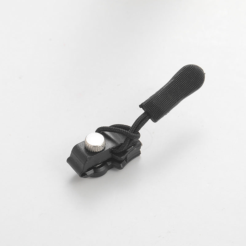 Single black zipper repair clip with adjustable strap and silver pin