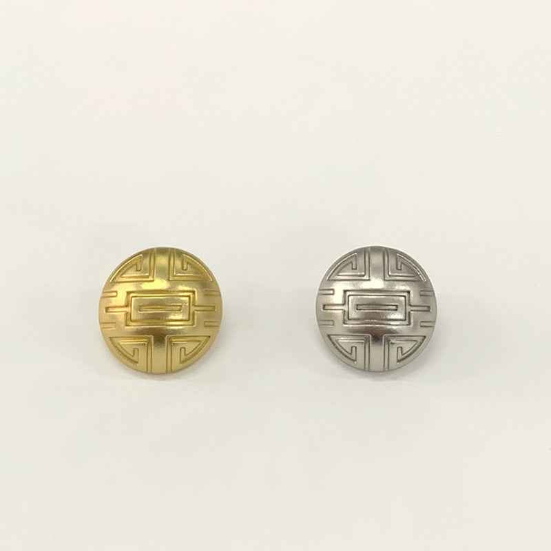 Round mushroom-design button faces with embossed symbols—gold and silver shown