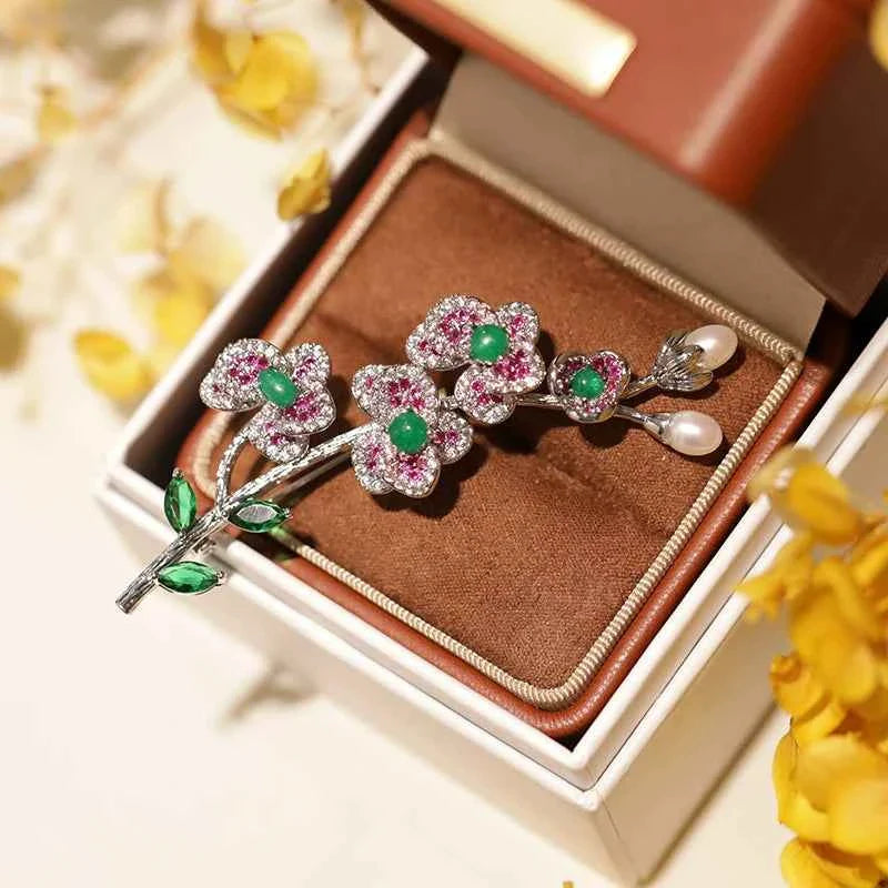 Flower and leaf brooch pin in gift box: green stones, red sparkles, pearl-like drops