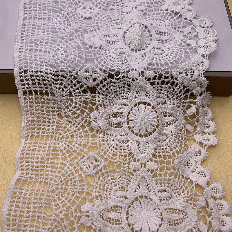 White embroidered lace trim roll-up strip with textured mesh background and flower motifs
