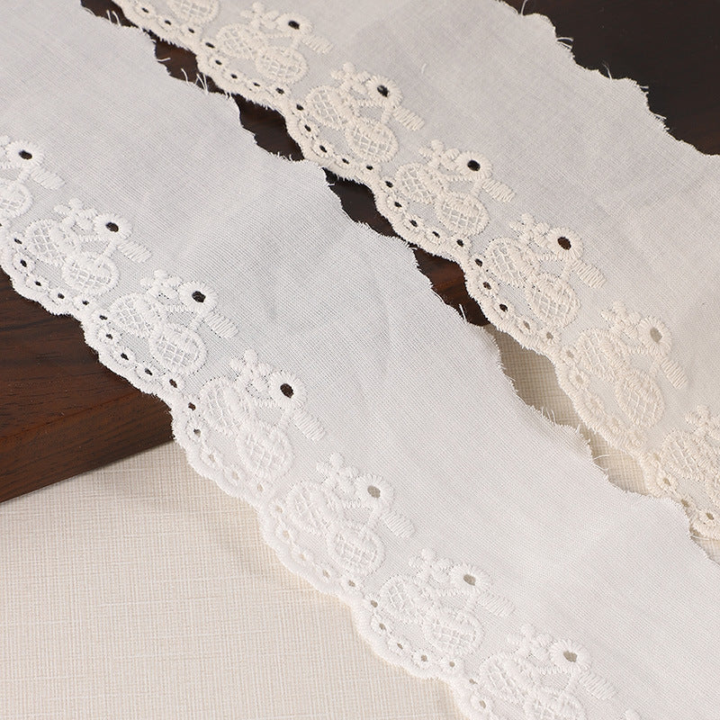 60mm cotton lace trim, white with embroidered floral eyelets for hems