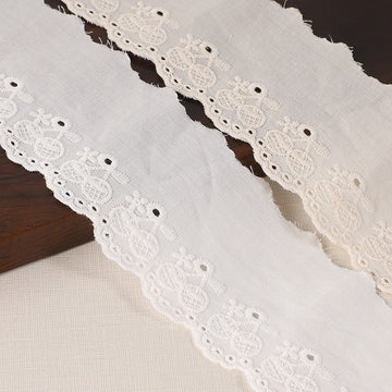 60mm cotton lace trim, white with embroidered floral eyelets for hems