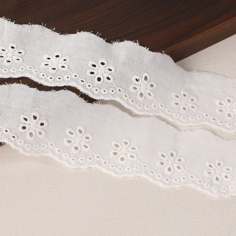 Cotton lace trim 45/70mm, white with rows of embroidered hole motifs