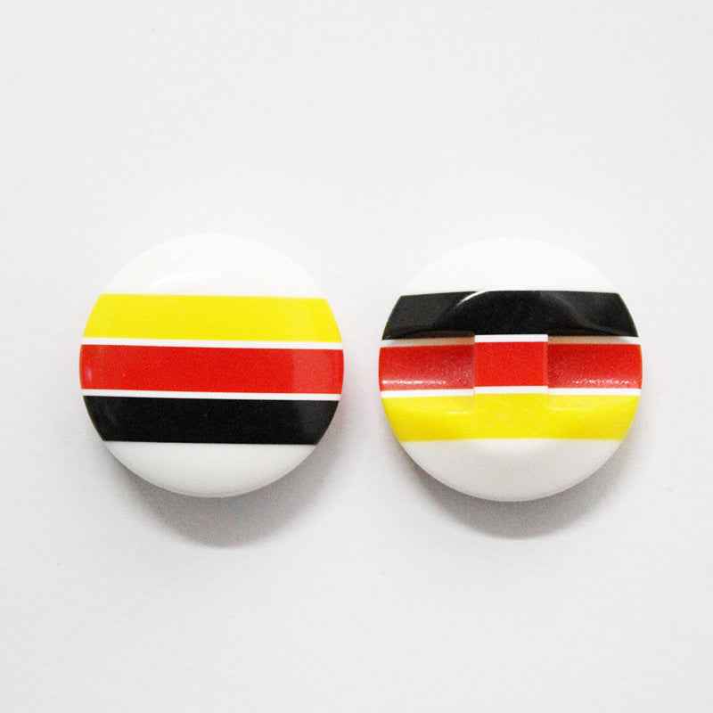 Colorful striped resin buttons with bold striped bands in blue, purple, green, and red