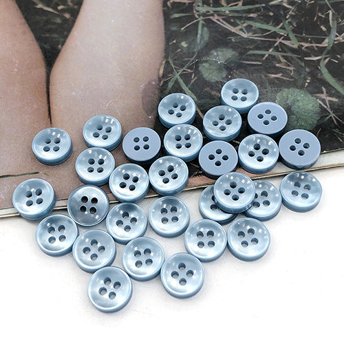 Powder blue-gray round 4-hole shirt buttons, clear four-hole arrangement