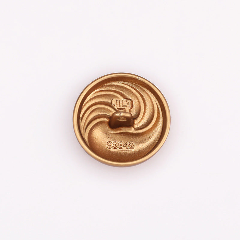 Sand gold spiral textured round metal shank button, back with printed code 83642