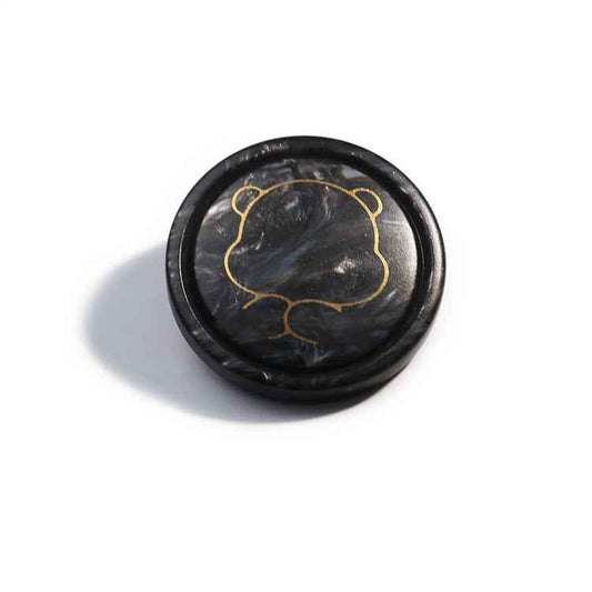 Black bear resin shank button with gold cartoon outline design